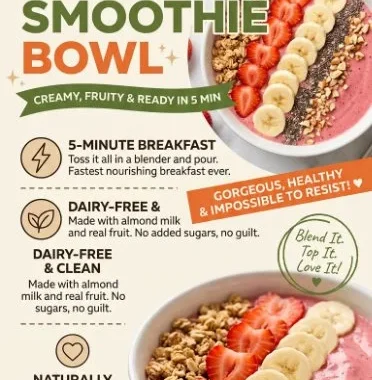 Delicious strawberry banana smoothie bowl topped with fresh fruit and seeds.