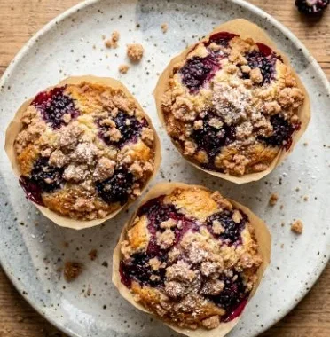 Delicious blackberry crumb muffins fresh out of the oven