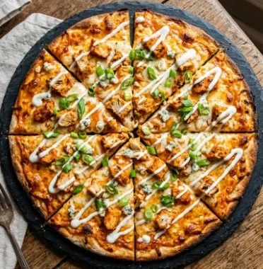 Buffalo Chicken Pizza 2 Delicious Buffalo Chicken Pizza topped with spicy chicken and melted cheese