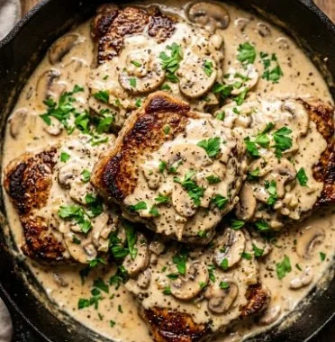 Creamy garlic mushroom cube steak skillet dinner ready to serve.