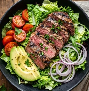 Delicious grilled steak avocado salad with fresh ingredients