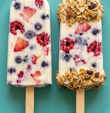 Colorful yogurt berry pops on a wooden stick, perfect for a refreshing treat.