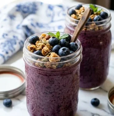 Delicious blueberry chia pudding topped with fresh blueberries and nuts