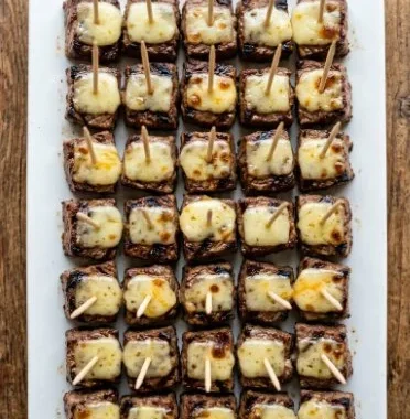 Steak and cheese appetizer bites served on a platter