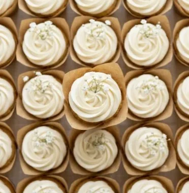 Elegant white wedding cupcakes decorated for a beautiful celebration