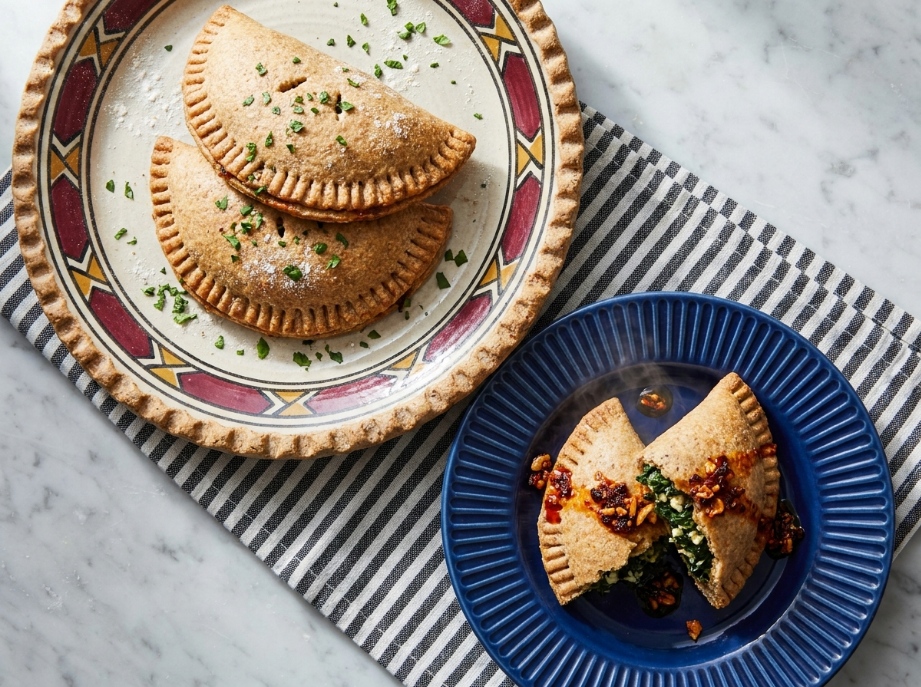 Chili Crisp Spinach and Feta Hand Pies serve